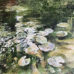 Watercolour painting of lilies on a pond